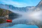 Slovenia, Lake Bohinj. Lake boats on foggy morning. Art Print